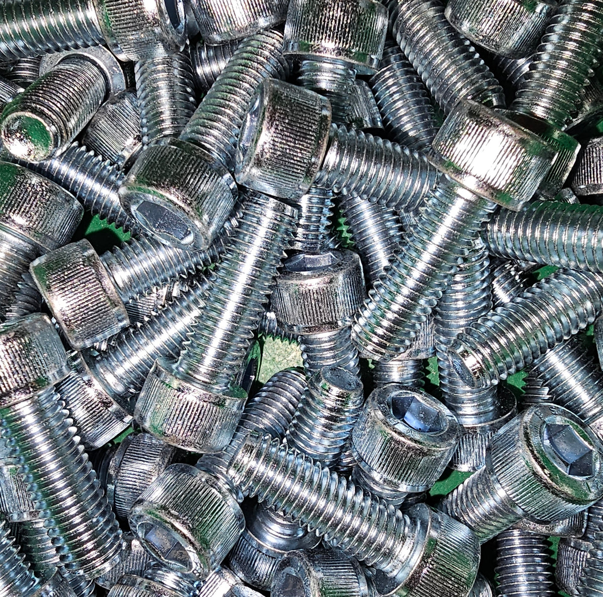 Zinc socket cap screw by Bolt Direct showing a close-up of the threaded metal screw with hex socket head.