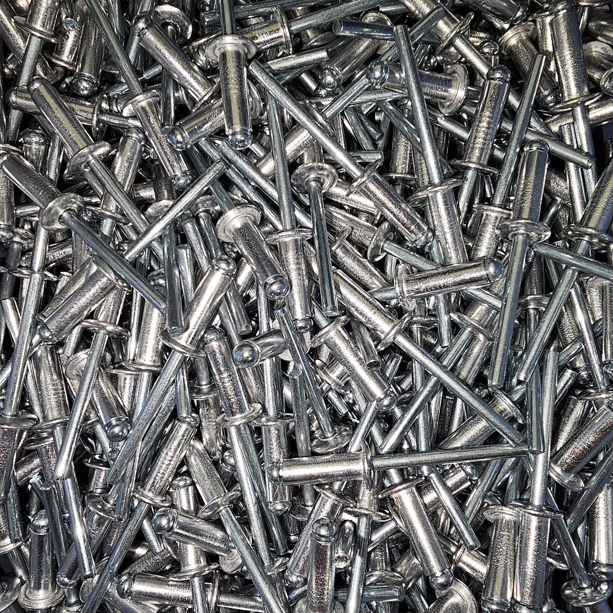 Aluminium and steel rivets from Bolt Direct, showing close-up of shiny rivet heads and metal shafts for industrial fastening.